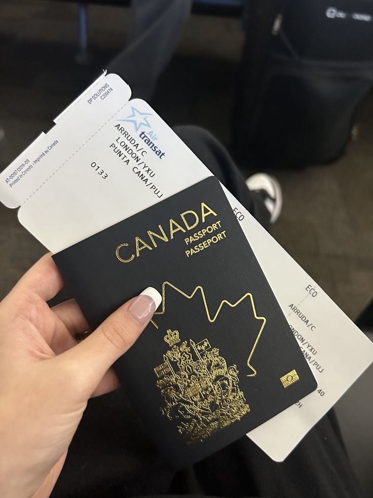 Travel documents and a Canadian passport in an airport setting